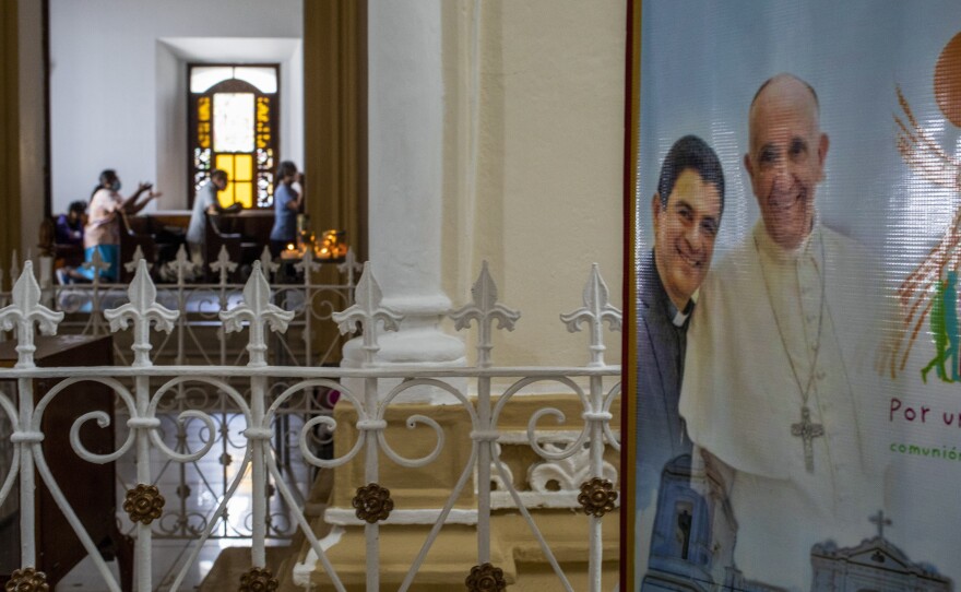 A poster featuring Bishop Rolando Álvarez and Pope Francis hangs inside the Cathedral in Matagalpa, Nicaragua, on Friday.