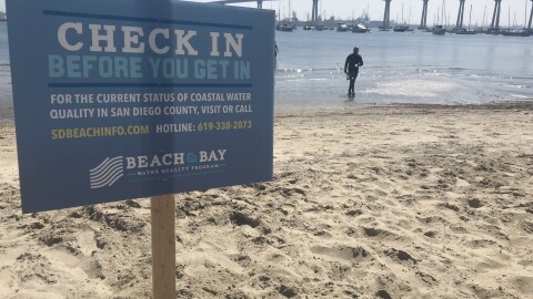 Dennis Purcell finishes taking water sample at Tidepool Beach in Coronado on Aug 8, 2019. 