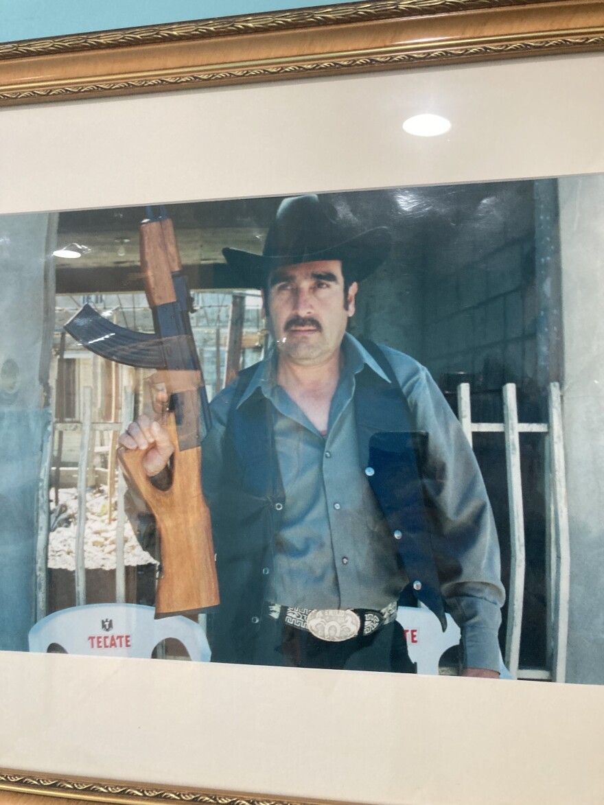 A younger Emilio Montiel on set, holding a prop rifle during the making of one of his early films.