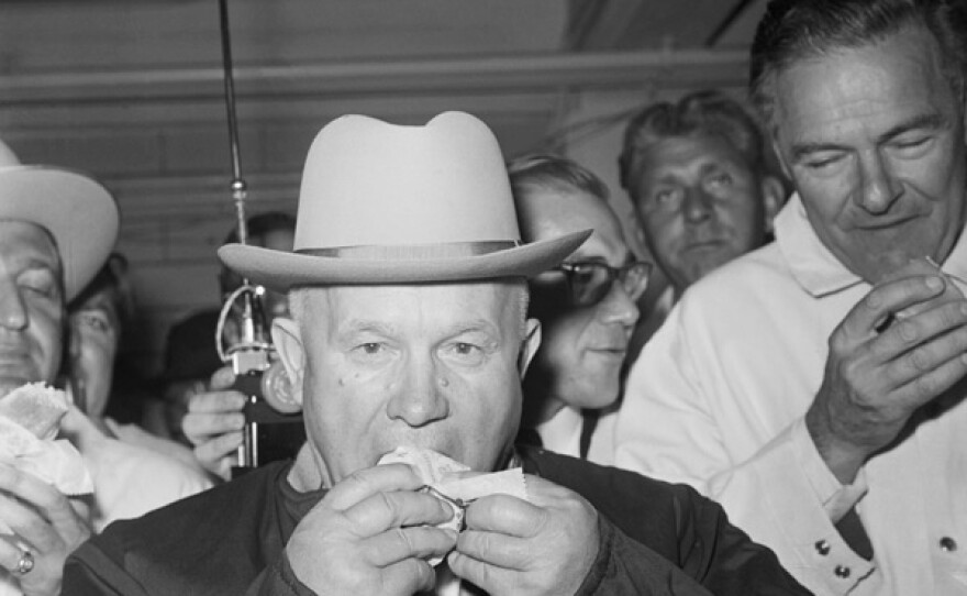 Soviet PreMier Nikita Khrushchev tastes his first American hot dog, complete with mustard, here Sept 22, 1959. After finishing the hot dog, the Communist boss was asked what he thought of it. He replied "OK, excellent, wonderful," but then added that it wasn't enough. Khruschev arrived earlier form San Francisco.