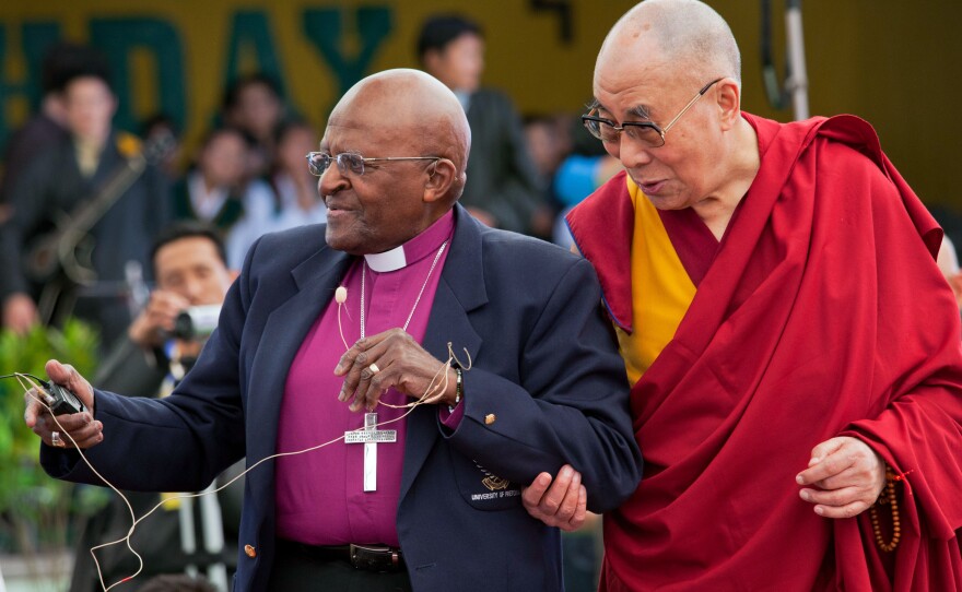 Retired Archbishop Desmond Tutu and Tibetan spiritual leader the Dalai Lama interact with children at the Tibetan Children's Village School in Dharmsala, India, in 2015. The two Nobel laureates held a series of conversations in Dharmsala aimed at giving shape to their collaborative work, <em>The Book of Joy</em>.