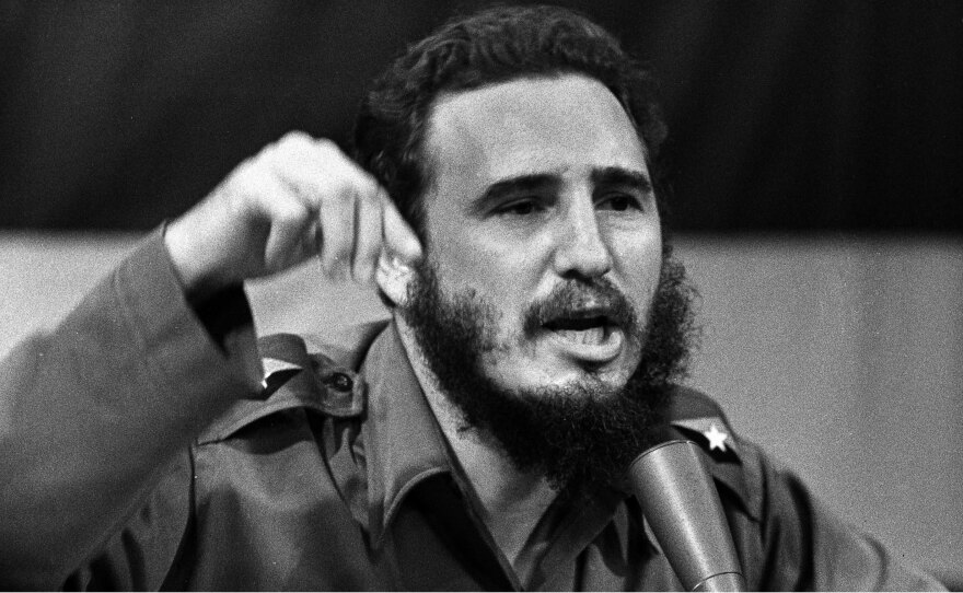 Cuban leader Fidel Castro delivering a speech in Cuba, on Oct. 23, 1962, and below, President John F. Kennedy calls on a reporter at a news conference in Washington, in April 1963.