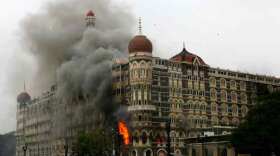 The Taj Mahal Hotel engulfed in smoke during the 2008 attack on Mumbai.