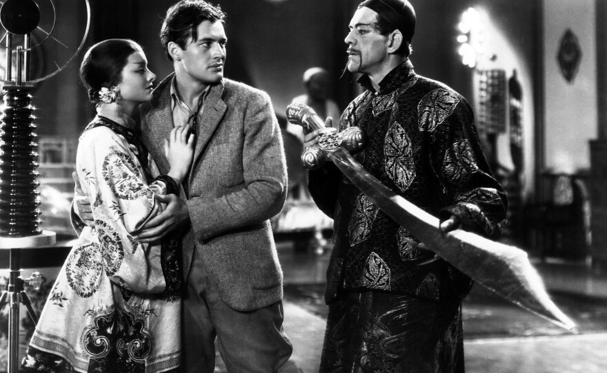 Terrence (Charles Starrett) falls into the clutches of Fu Manchu (Boris Karloff) and his daughter Fah Lo See (Myrna Loy) in the 1932 pre-Code Hollywood film "The Mask of Fu Manchu."