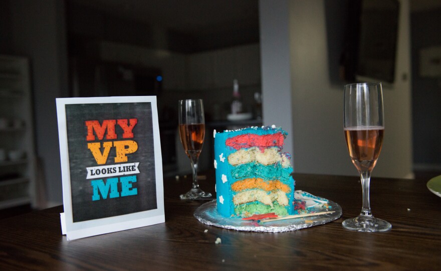 A cake, a glass of sparkling grape juice and other party props sit on a table at an Inaugration Day party at the Golla household in Chesterfield, Mo. Although the past year has been challenging, a high point for the South Asian community was to see Kamala Harris take the oath as vice president.