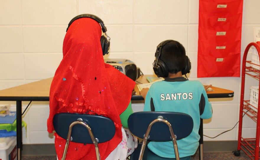 Two students in a "newcomer" class at Florence Wilson Elementary School in Garden City — a Somali girl (left), and a Hispanic boy.