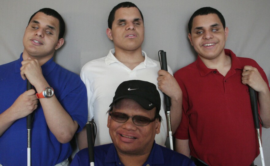 The lives of Leo, Nick and Steven Argel (from left) changed the day Ollie Cantos knocked on their door.