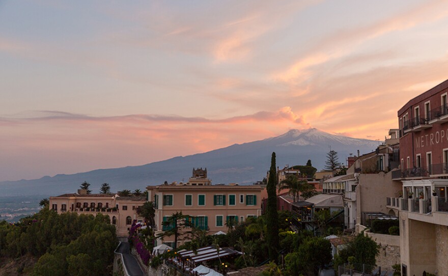 Mt. Etna and Taormina, Sicily at dusk.