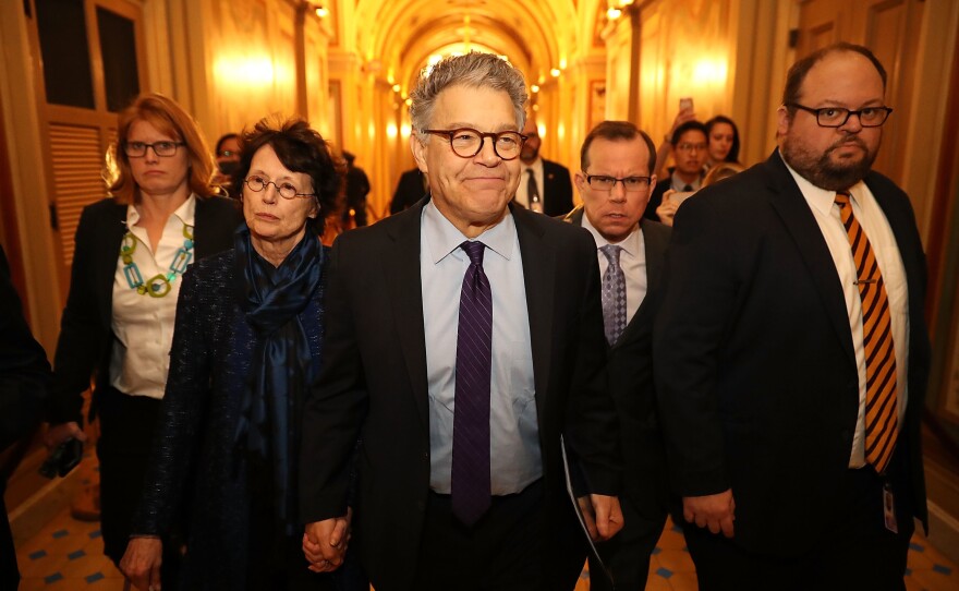 Sen. Al Franken, D-Minn., and his wife Franni Bryson (left) arrive at the U.S. Capitol on Thursday. Franken announced on the Senate floor that he would be resigning "in the coming weeks."