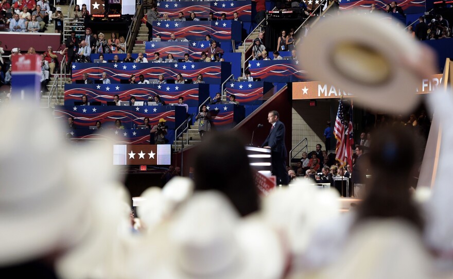 Delegates from Texas listen as Texas senator and former Republican presidential candidate Ted Cruz addresses Wednesday evening's session of the Republican National Convention in Cleveland.