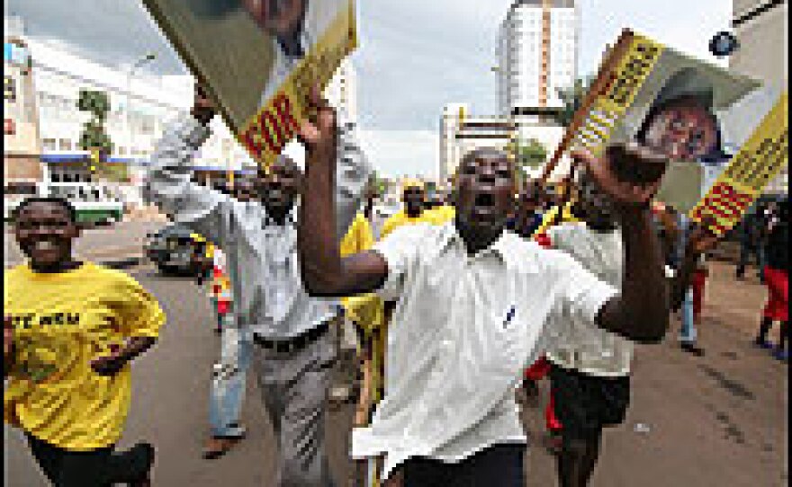 Members of President Yoweri Kaguta Museveni's National Resistance (NRM) Party's Youth Brigade march through the streets of the capital Kampala.