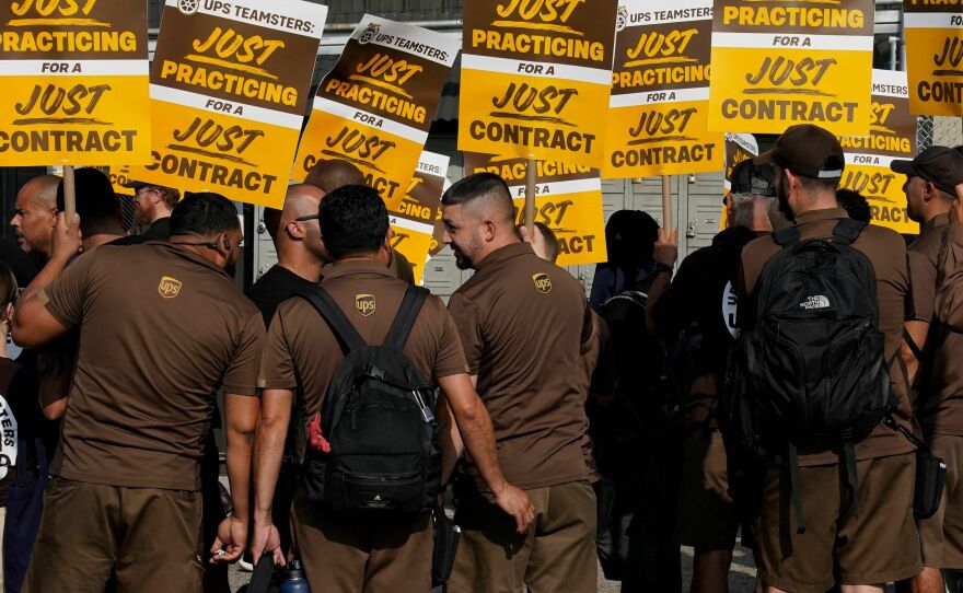 UPS workers walk a "practice picket line" in New York City on July 7, 2023. The UPS union won a lucrative contract after negotiations earlier this year.