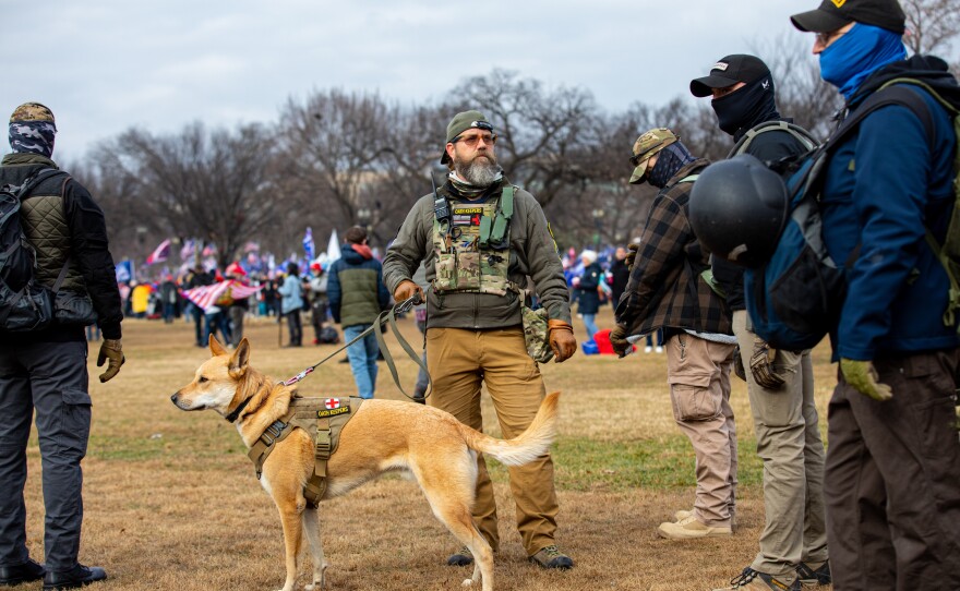 Men wearing Oath Keepers insignia and military tactical gear attend the "Stop the Steal" rally on Jan. 6 in Washington, D.C. Later that day Trump supporters, including more than 20 people who appear to be members of the Oath Keepers, breached the U.S. Capitol.