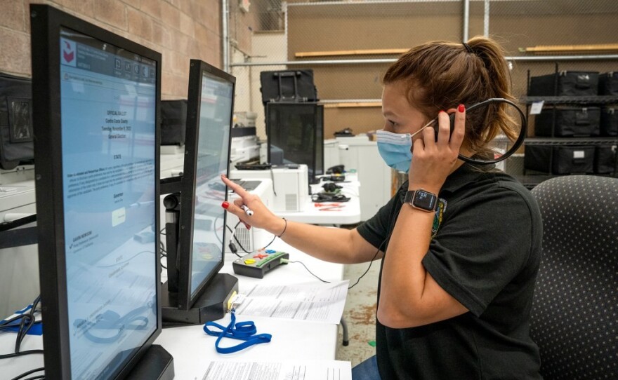 Alicia Little, an election services specialist, tests the logic and accuracy of an accessible voting machine called ICX at the Contra Costa County Elections Department on Sept. 30, 2022.