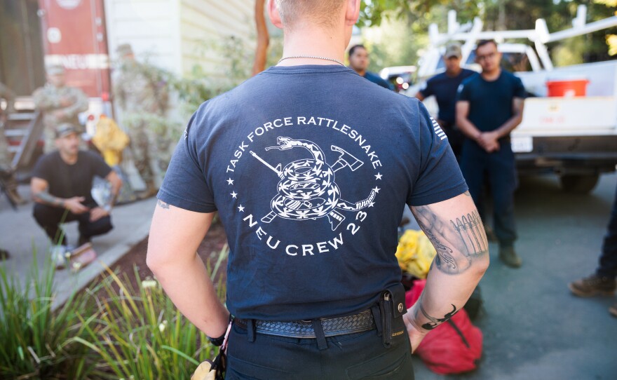Members of the California National Guard's Task Force Rattlesnake gather in Nevada City, Calif., to begin their day.