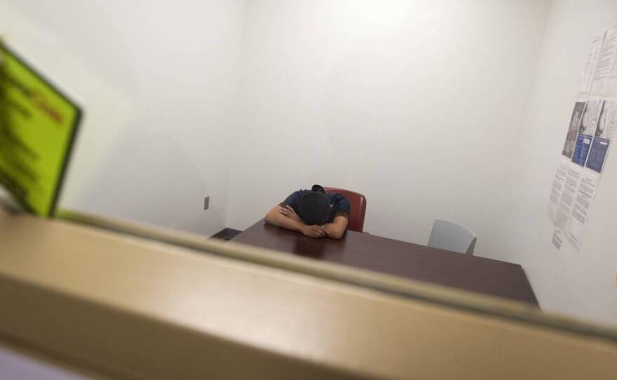 Luna Guzmán puts her head down and cries after her interview with reporters Sasha Khokha and Erin Siegal McIntyre.