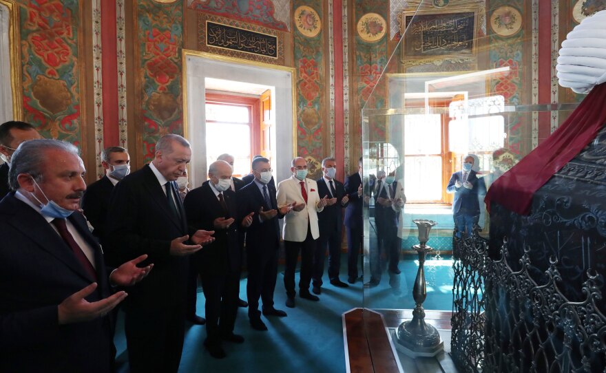Turkish President Recep Tayyip Erdogan prays by the tomb of Mehmet the Conqueror after attending Friday prayers at Hagia Sophia.