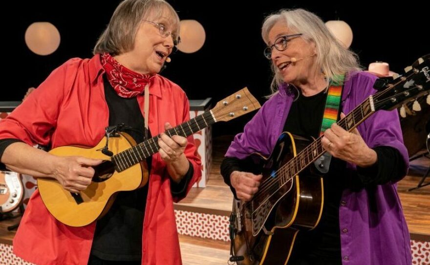 Grammy Award-winning musicians Marcy Marxer and Cathy Fink sing about the unexpected humor they encountered during Marxer's seven-year fight with breast cancer in the concert film, <em>All Wigged Out</em>.