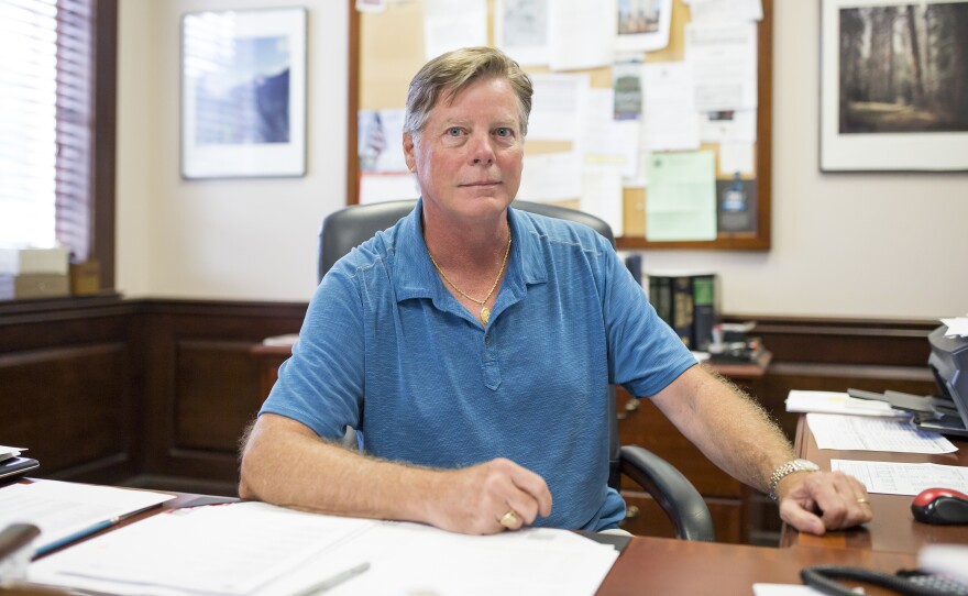 Michael Stevens, senior executive vice president of Vaughan Furniture Company, sits at his desk in Galax, Va. Following the decline of the furniture production industry in Galax, the Vaughan Furniture Company was forced to largely shut down. Now Stevens oversees the leasing of their facilities and office spaces to other companies as they try to sell their large properties in town.