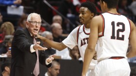 San Diego State basketball coach Steve Fisher talks with guard Jeremy Hemsley, rear, during the first half of a game against Kansas on Dec. 22, 2015, in San Diego.