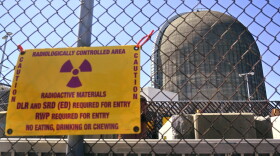A sign warning of radioactive materials is seen on a fence outside Indian Point Energy Center in Buchanan, N.Y. just days before it closed in 2021. The Trump administration is seeking to overhaul nuclear safety rules to aid a nuclear revival.