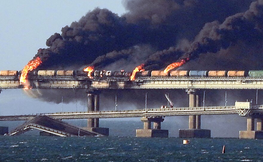 Black smoke billows from a fire on the Kerch bridge that links Crimea to Russia after an explosion on Saturday.
