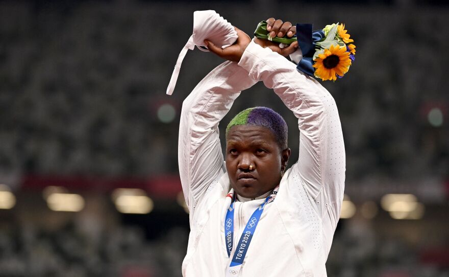 Second-placed USA's Raven Saunders gestures on the podium with her silver medal after competing the women's shot put event during the Tokyo 2020 Olympic Games at the Olympic Stadium in Tokyo on Sunday.