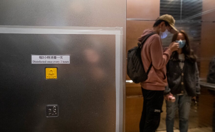 Signs in public spaces like Hong Kong University remind people that there are sanitary practices in place to prevent the spread of the virus.