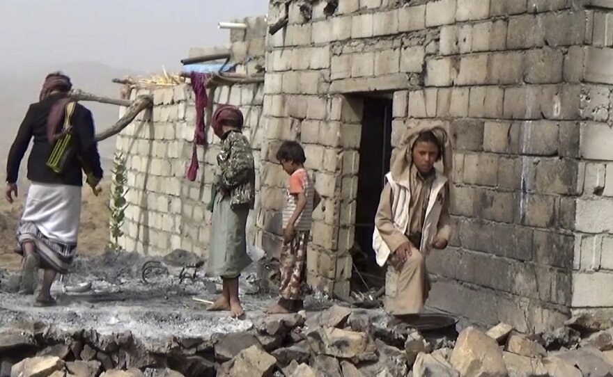 Yemeni residents inspect a house that was damaged during a Jan. 29 U.S. raid on the tiny village of Yakla, in central Yemen.