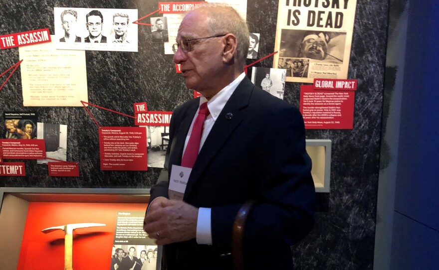 H. Keith Melton, a longtime collector of spy artifacts, stands next to the axe that was used to kill Soviet exile Leon Trotsky in Mexico in 1940. The axe is part of Melton's huge collection that he's donated to the new International Spy Museum.