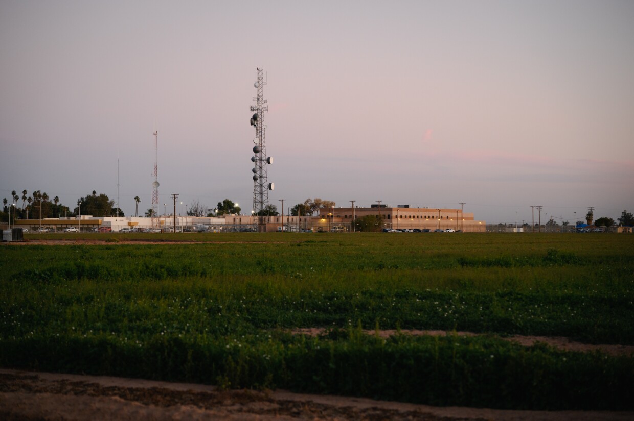 Fading evening light illuminates homes, farmland and the Imperial County Sheriff’s Office in El Centro, California on February 12, 2024.