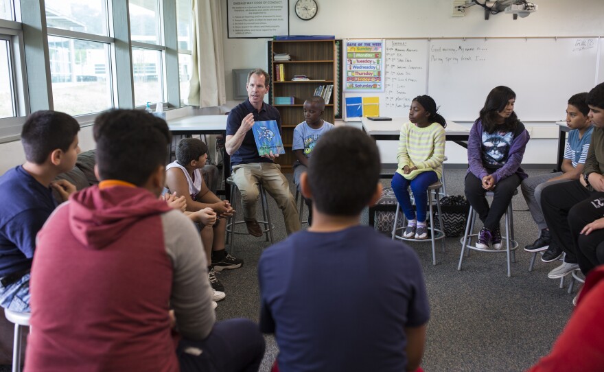 Teacher Christopher Baughman is shown working with students at Emerald middle school in El Cajon in this undated photo.