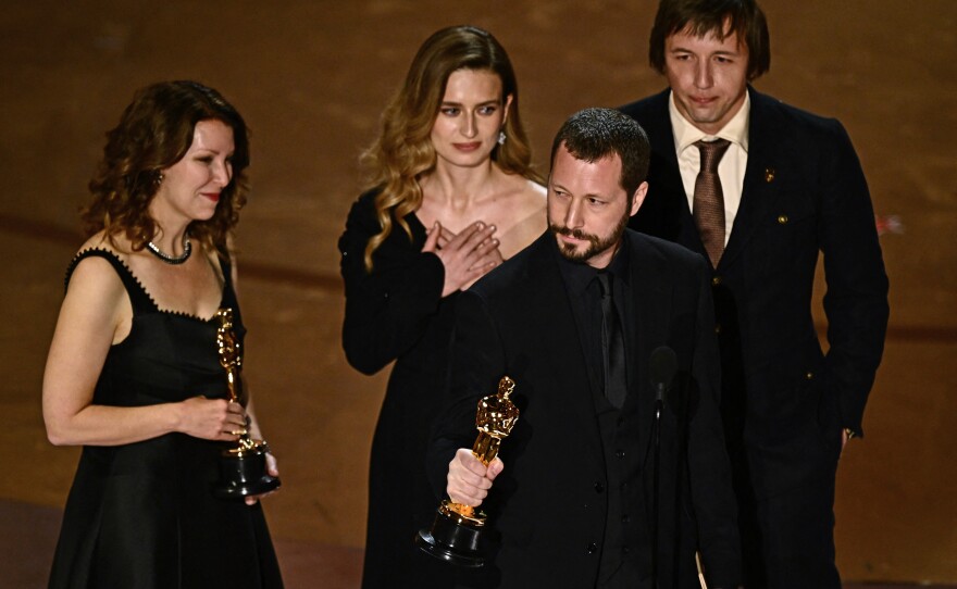Filmmaker Mstyslav Chernov accepts the award for best documentary feature film for <em>20 Days in Mariupol</em> during the 96th Annual Academy Awards.