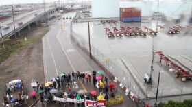 Protesters block an entrance to the San Diego Port on the morning of Monday, Dec. 12, 2011 as part of the Occupy Wall Street movement targeted at ports up and down the West Coast.