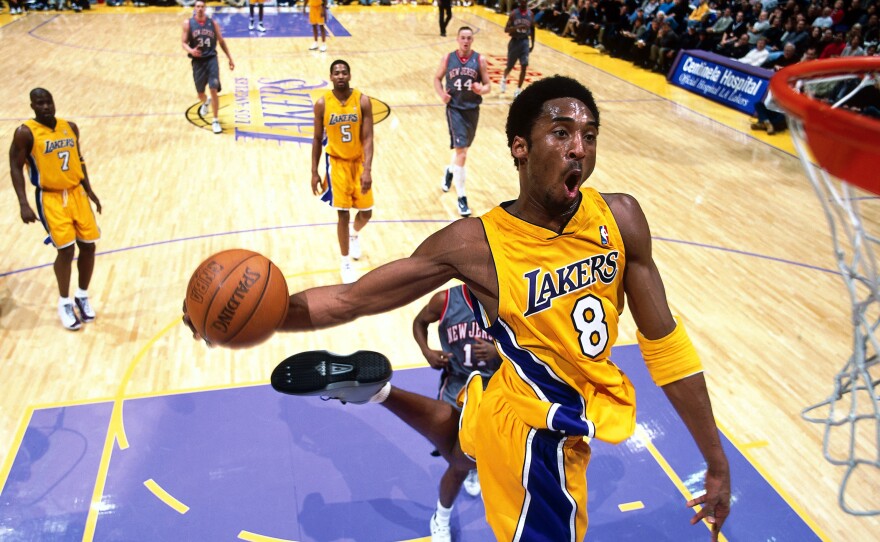 Kobe Bryant goes in for a dunk against the New Jersey Nets during a game at the Staples Center in Los Angeles on Jan. 1, 2001.