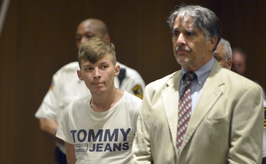 Volodymyr Zhukovskyy, 23, stands with his attorney, Donald Frank, during a court session on Monday in Springfield, Mass. He has pleaded not guilty to seven counts of negligent homicide in connection with a crash that killed seven motorcyclists in New Hampshire.