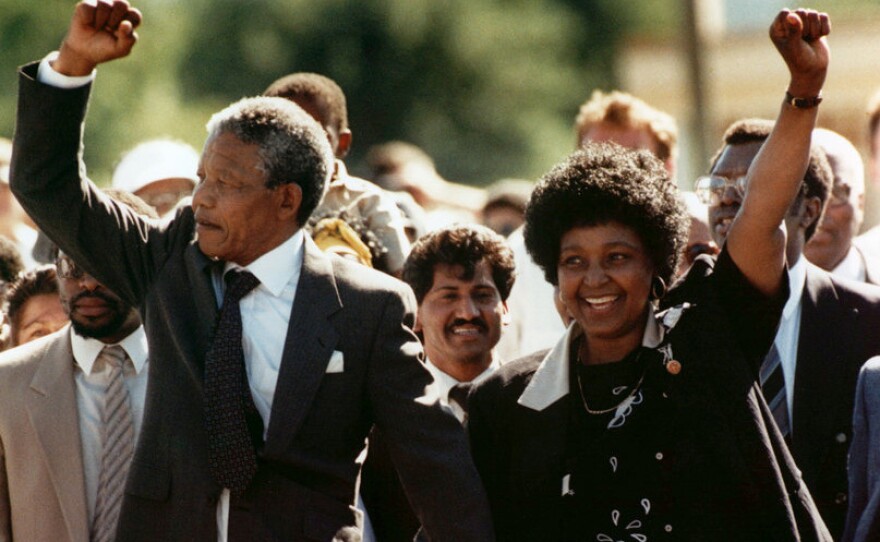 Nelson Mandela, with his wife, Winnie, walks to freedom after 27 years in prison on Feb. 11, 1990, in Cape Town.