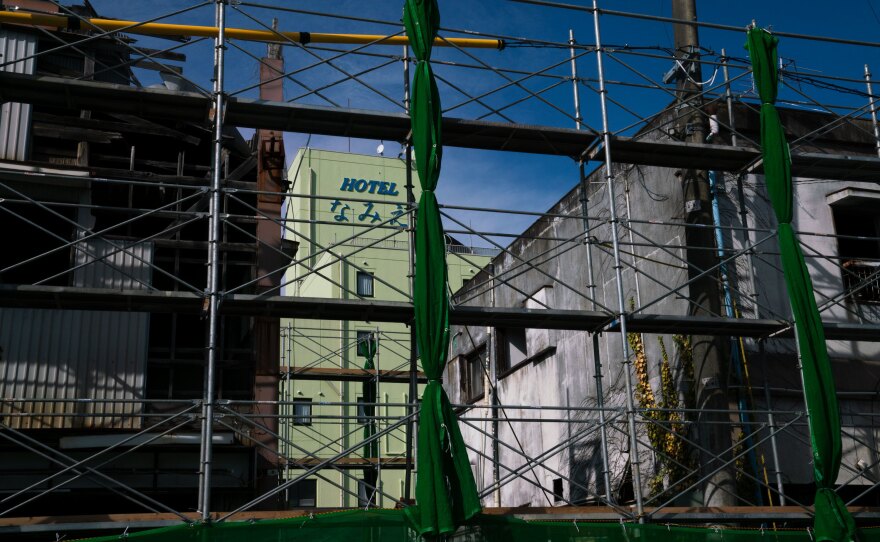 Construction scaffolding is set up in front of some of Namie's downtown buildings. Namie has reopened and is starting to come back to life — even if only a fraction of the population has returned.