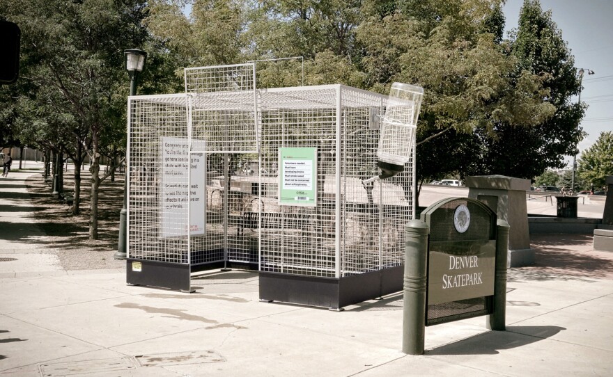 This human-scale lab rat cage is  parked near a skate park in Denver, Colo., to make a point about the lack of science on marijuana.