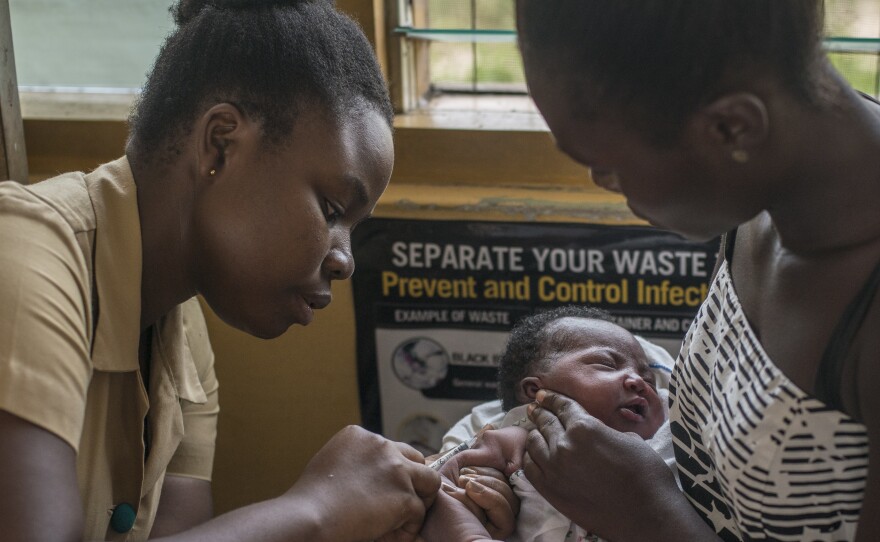 A nurse administers the world's first malaria vaccine during a 2019 pilot program in Ghana. The World Health Organization has now recommended the vaccine for use in countries with moderate to high levels of malaria transmission.