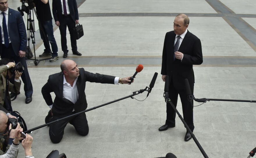 Russian President Vladimir Putin speaks with members of the press after his annual call-in show in Moscow on April 14.