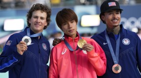 Gold medalist Yuto Horigome, of Japan, center, poses with silver medalist Jagger Eaton, of the United States, left, and bronze medalist Nyjah Huston, of the United States, after the men's skateboard street final at the 2024 Summer Olympics, Monday, July 29, 2024, in Paris, France.
