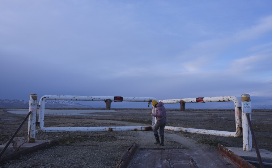 Wildlife biologist Carly Biedul of the Great Salt Lake Institute closes the last of many gates to the protected Gillmor Sanctuary along the south shores of the Great Salt Lake.