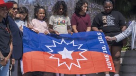 Students raise the Juneteenth flag over San Diego Unified headquarters, Tuesday, in honor of the national holiday, San Diego, Calif., June 18, 2024