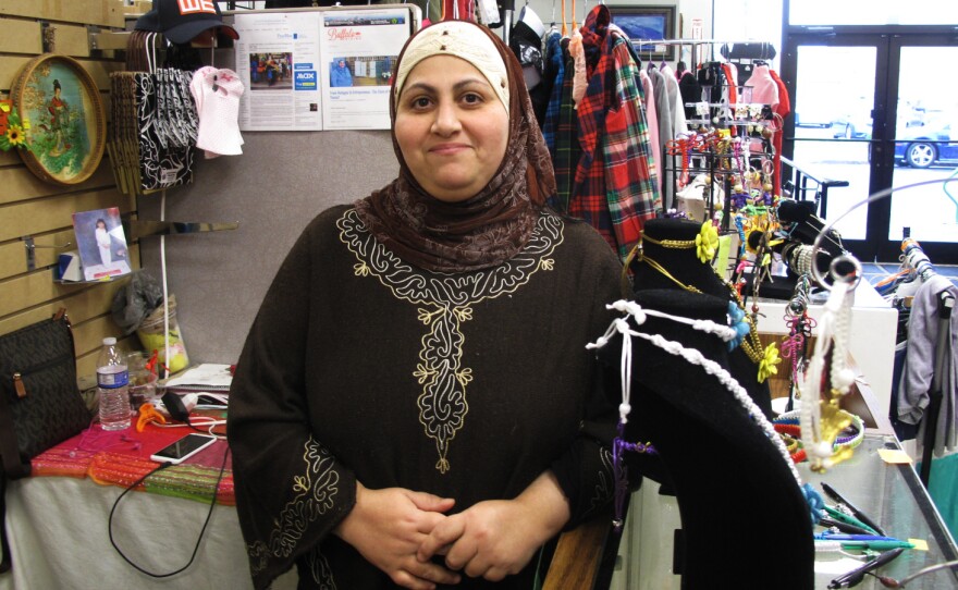 Nadeen Yousef in her booth, Macrame by Nadeen, at the West Side Bazaar, in Buffalo. Yousef moved to Buffalo from Iraq in 2014. "We are like family here — family from different countries," she says.