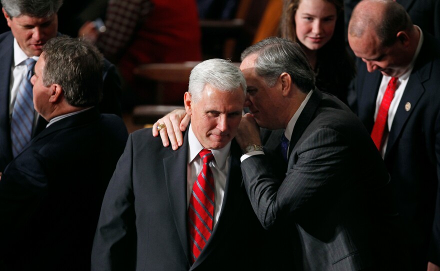 Pence talks with fellow Republicans during the first session of the 112th Congress in 2011.