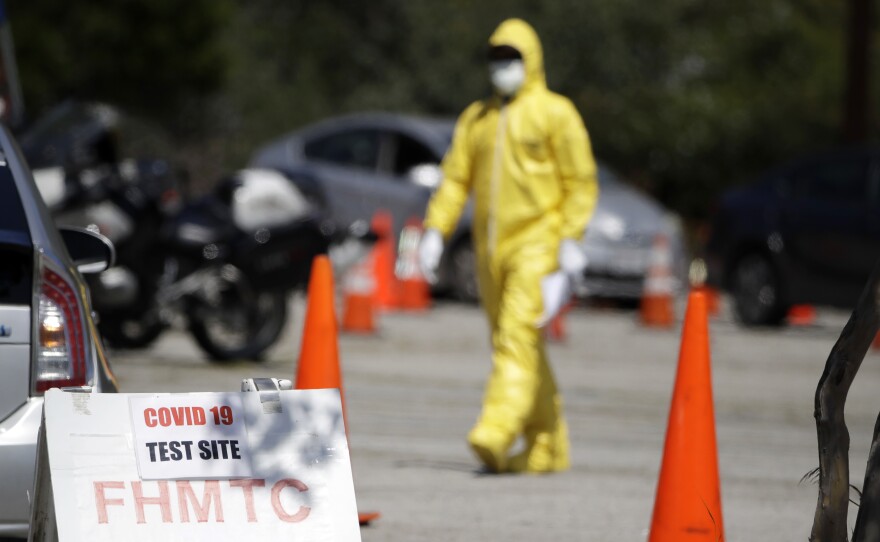 A person wearing protective equipment at a coronavirus testing site for first responders, on Monday in Los Angeles.