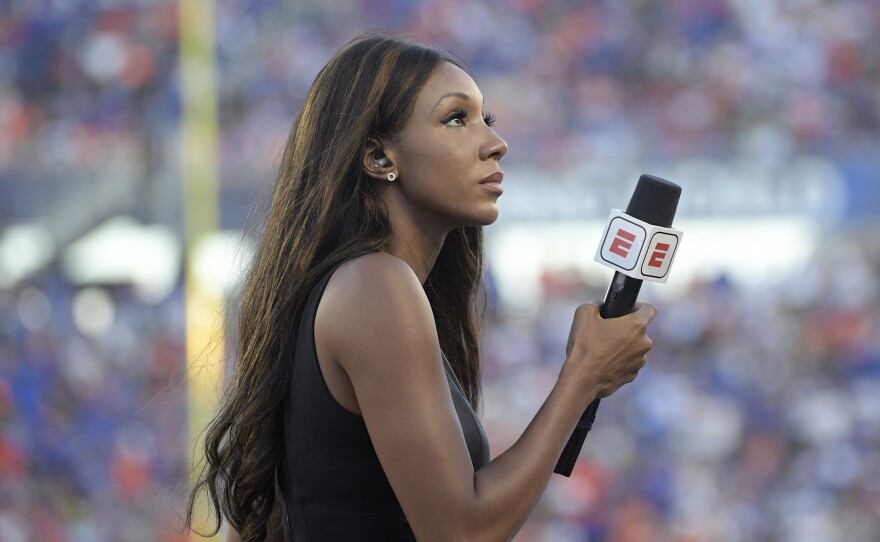 ESPN's Maria Taylor works from the sideline during the first half of an NCAA college football game between Miami and Florida Saturday, Aug. 24, 2019, in Orlando, Fla. ESPN announced Wednesday that she is leaving the network.