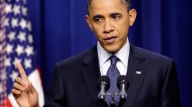 President Obama answers a question during a press conference Friday in Washington.