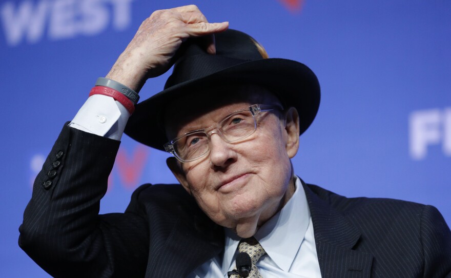 Former U.S. Sen. Harry Reid tips his hat during a November fundraiser for the Nevada Democratic Party in Las Vegas.